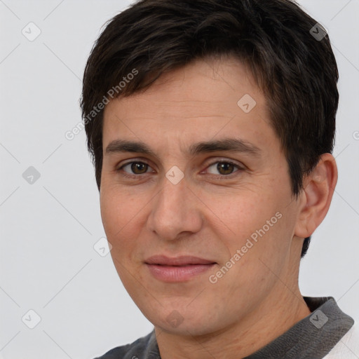 Joyful white adult male with short  brown hair and brown eyes