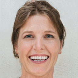 Joyful white adult female with short  brown hair and grey eyes