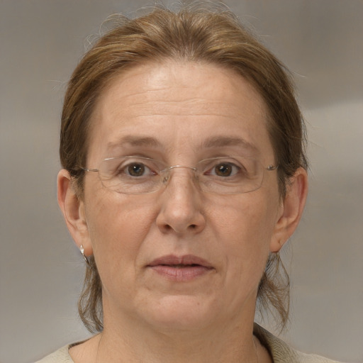 Joyful white middle-aged female with medium  brown hair and brown eyes