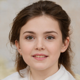 Joyful white child female with medium  brown hair and brown eyes