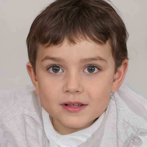 Joyful white child female with short  brown hair and blue eyes