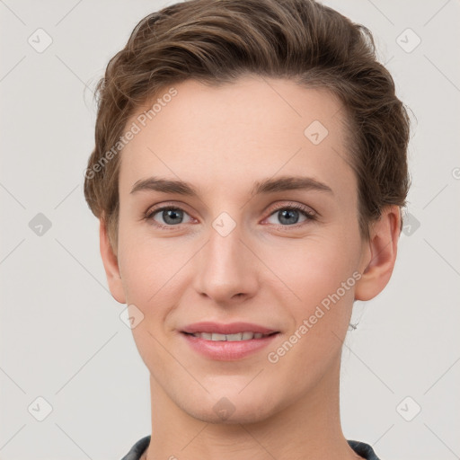 Joyful white young-adult female with short  brown hair and grey eyes