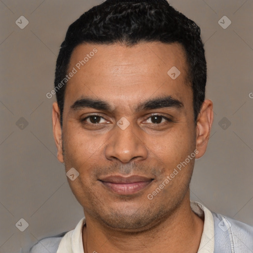 Joyful latino young-adult male with short  black hair and brown eyes