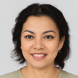 Joyful asian young-adult female with medium  brown hair and brown eyes