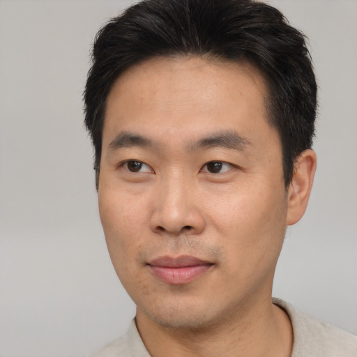 Neutral asian young-adult male with short  black hair and brown eyes