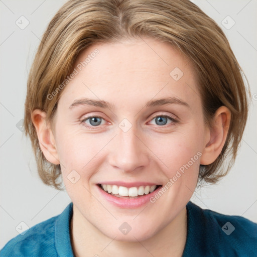 Joyful white young-adult female with medium  brown hair and blue eyes