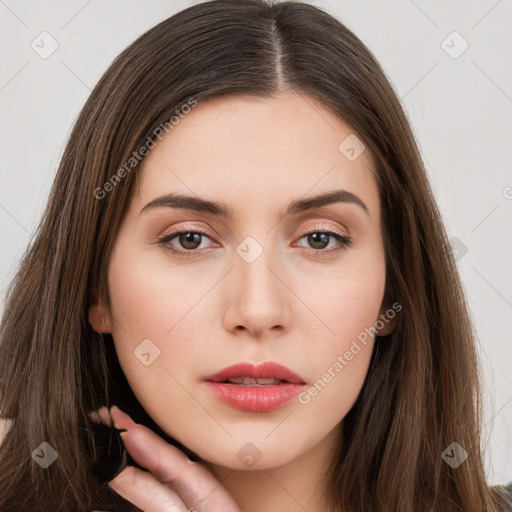 Neutral white young-adult female with long  brown hair and brown eyes