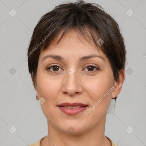 Joyful white adult female with short  brown hair and brown eyes