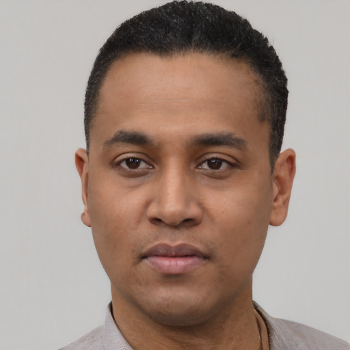 Neutral black young-adult male with short  black hair and brown eyes