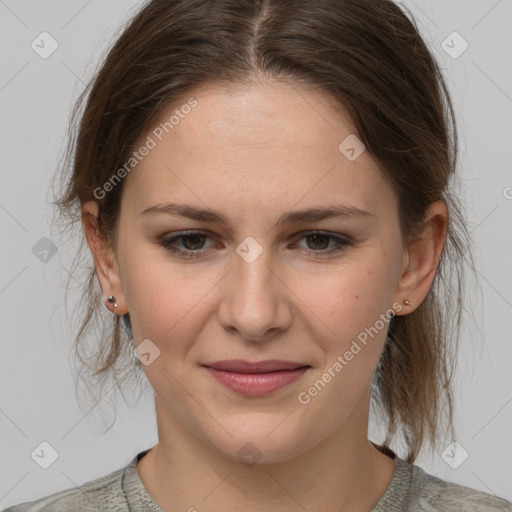 Joyful white young-adult female with medium  brown hair and grey eyes