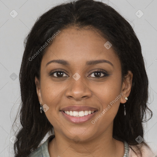 Joyful black young-adult female with long  brown hair and brown eyes