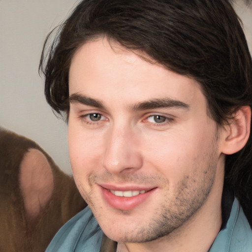 Joyful white young-adult male with medium  brown hair and brown eyes