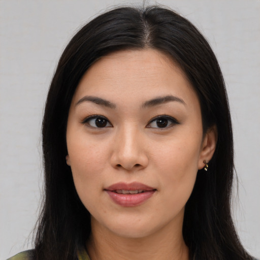 Joyful asian young-adult female with medium  brown hair and brown eyes