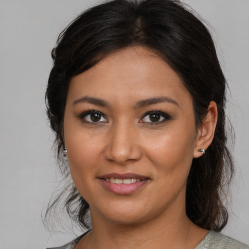 Joyful asian young-adult female with medium  brown hair and brown eyes