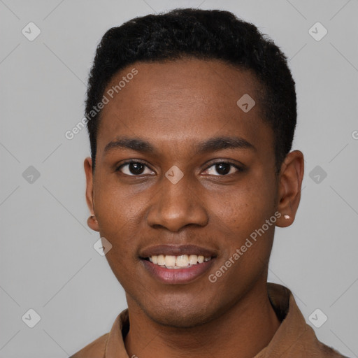 Joyful black young-adult male with short  black hair and brown eyes