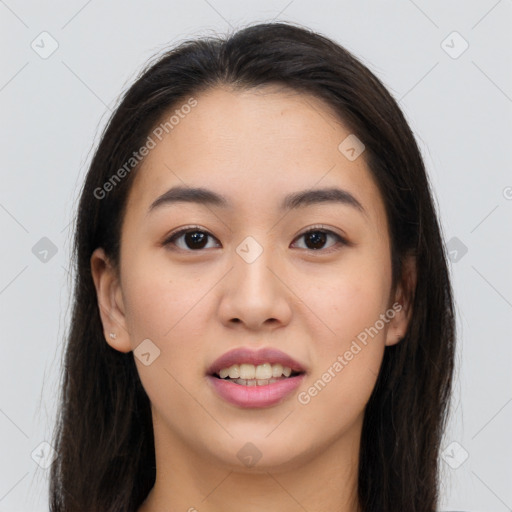 Joyful asian young-adult female with long  brown hair and brown eyes