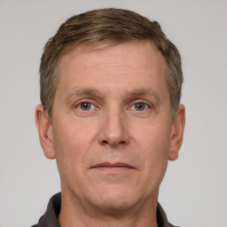 Neutral white adult male with short  brown hair and grey eyes