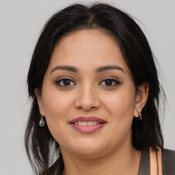 Joyful asian young-adult female with long  brown hair and brown eyes