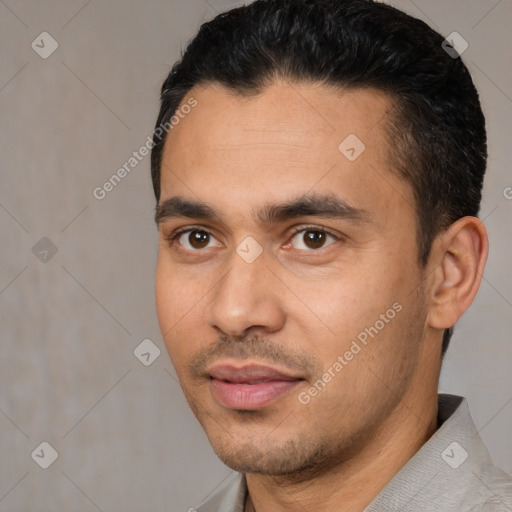 Joyful white young-adult male with short  black hair and brown eyes