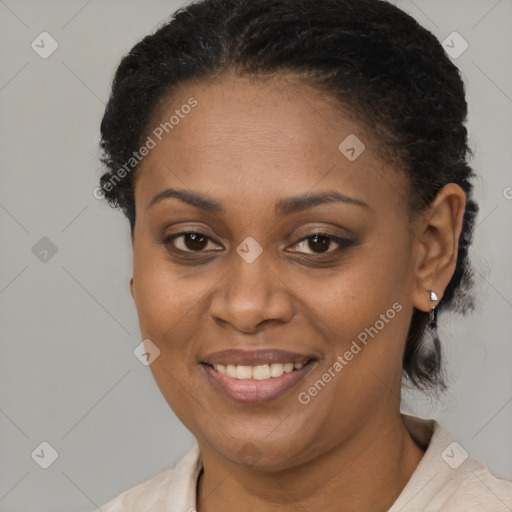 Joyful black adult female with short  brown hair and brown eyes