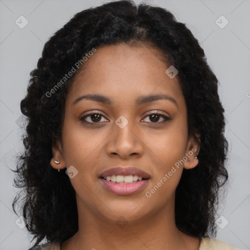 Joyful black young-adult female with long  brown hair and brown eyes