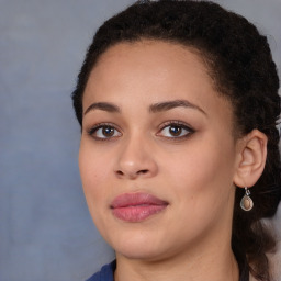 Joyful black young-adult female with medium  brown hair and brown eyes