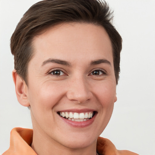 Joyful white young-adult female with short  brown hair and brown eyes