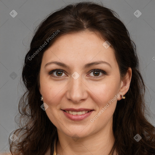 Joyful white adult female with long  brown hair and brown eyes