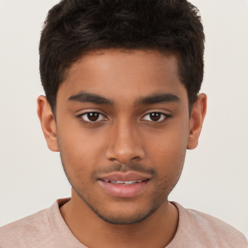 Joyful latino young-adult male with short  brown hair and brown eyes