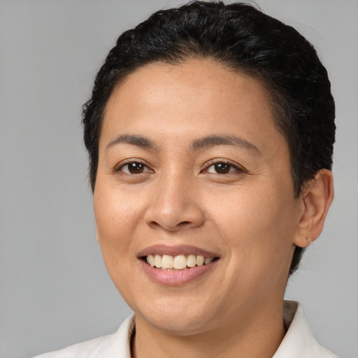 Joyful latino young-adult female with short  brown hair and brown eyes