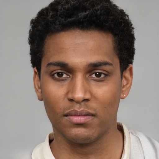 Neutral black young-adult male with short  black hair and brown eyes