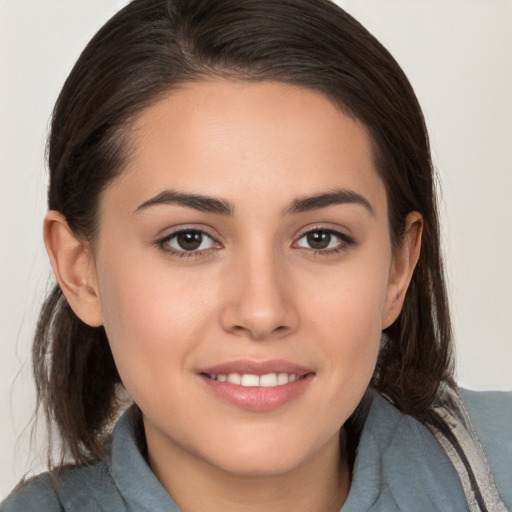 Joyful white young-adult female with medium  brown hair and brown eyes