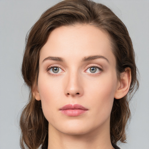 Neutral white young-adult female with medium  brown hair and green eyes