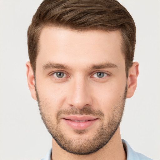 Joyful white young-adult male with short  brown hair and brown eyes