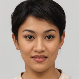 Joyful asian young-adult female with short  brown hair and brown eyes