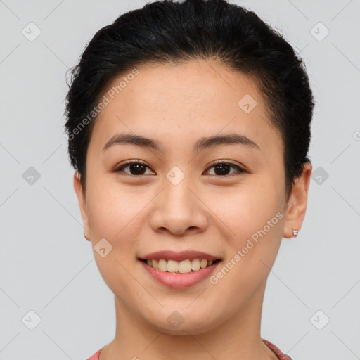 Joyful asian young-adult female with short  brown hair and brown eyes