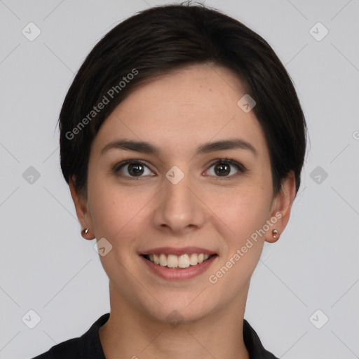 Joyful white young-adult female with short  brown hair and brown eyes