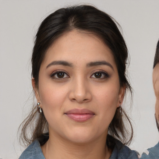Joyful white young-adult female with medium  brown hair and brown eyes