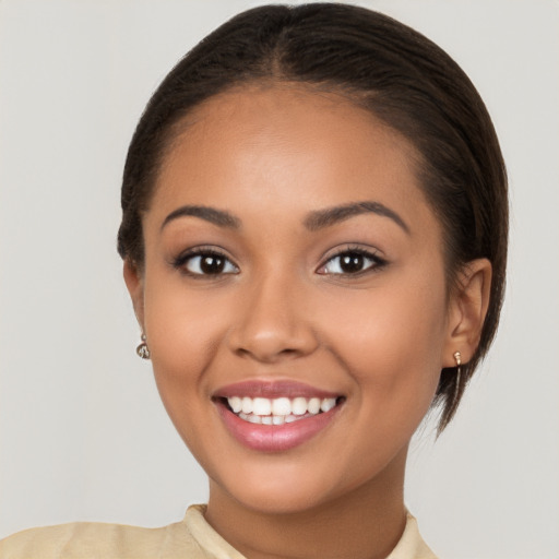 Joyful latino young-adult female with short  brown hair and brown eyes