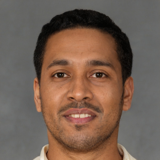 Neutral latino adult male with short  brown hair and brown eyes