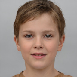 Joyful white child male with short  brown hair and brown eyes