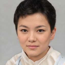 Joyful white child female with short  brown hair and brown eyes
