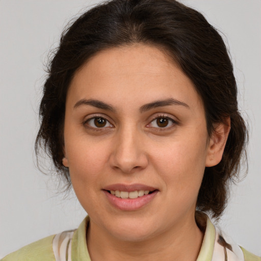 Joyful white young-adult female with medium  brown hair and brown eyes