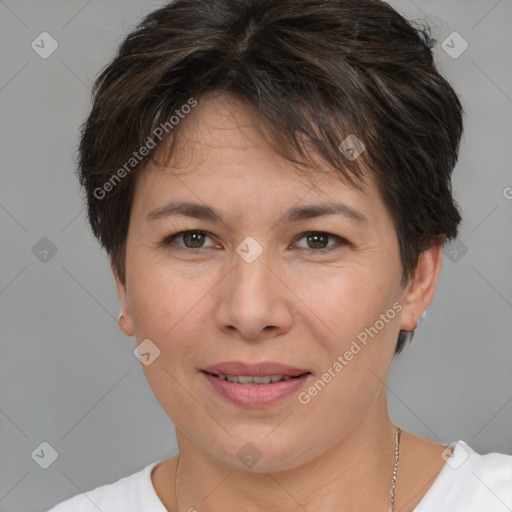 Joyful white adult female with short  brown hair and brown eyes