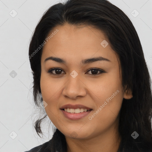 Joyful asian young-adult female with long  black hair and brown eyes