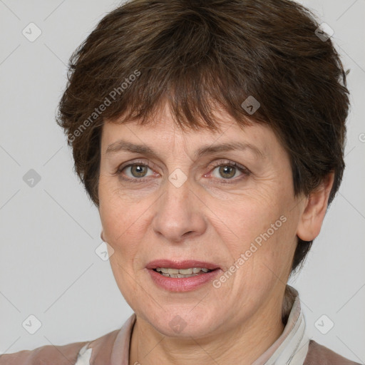 Joyful white adult female with short  brown hair and grey eyes