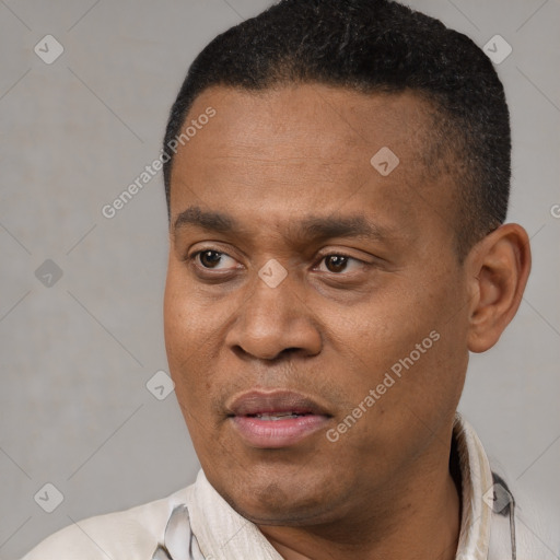 Joyful latino adult male with short  black hair and brown eyes