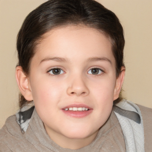 Joyful white child female with medium  brown hair and brown eyes