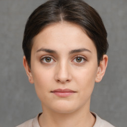 Neutral white young-adult female with short  brown hair and brown eyes