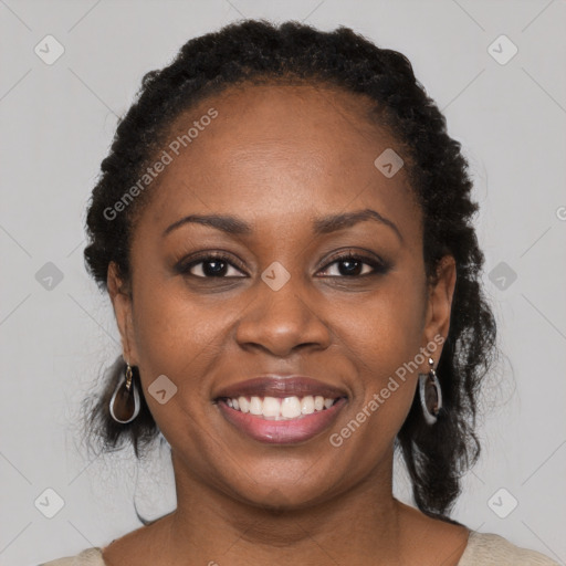 Joyful black young-adult female with medium  black hair and brown eyes